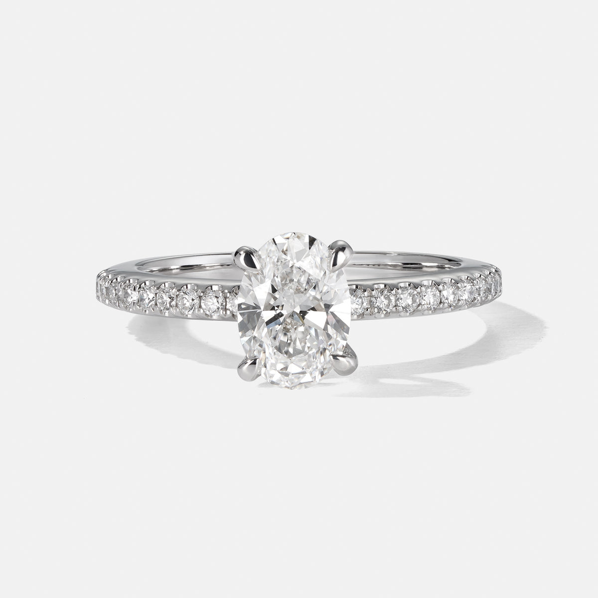 Oval 4 Claw Engagement Ring Diamond on shoulders